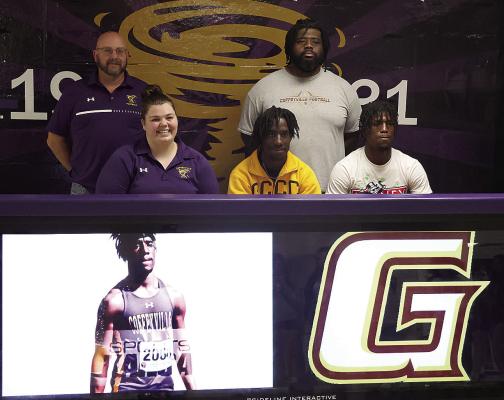 Senior Amir Luten signed with Garden City Community College for Track. He is shown with his sister-in-law Megan Wade and his brother Amanie Luten. Back row: track coach Jeremy Neuenschwander and brother Deonta Wade. FKHS Newspaper | Courtesy Photo